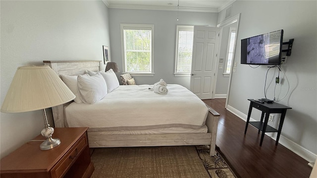 7810 Whitemarsh Way, Reunion, FL 34747 - bedroom with dark wood finished floors, baseboards, and ornamental molding