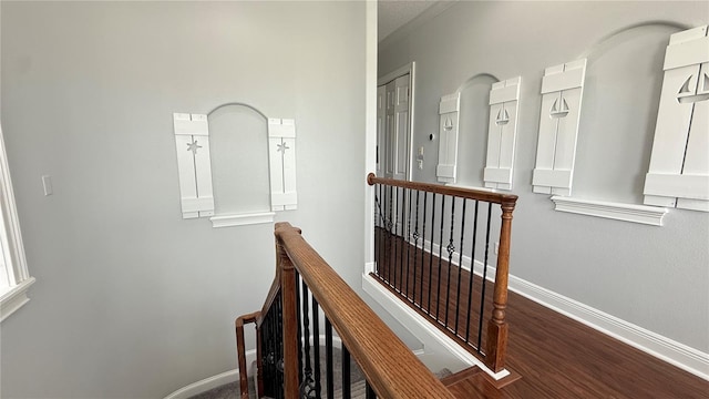 7810 Whitemarsh Way, Reunion, FL 34747 - corridor featuring an upstairs landing, baseboards, and wood finished floors
