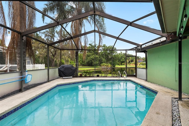 6621 Appaloosa Dr, Tampa, FL 33625 - outdoor pool featuring a grill, a patio area, and a lanai