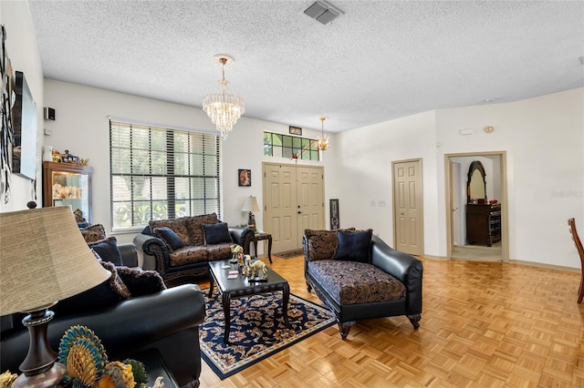 6621 Appaloosa Dr, Tampa, FL 33625 - living area featuring a chandelier, a textured ceiling, and baseboards