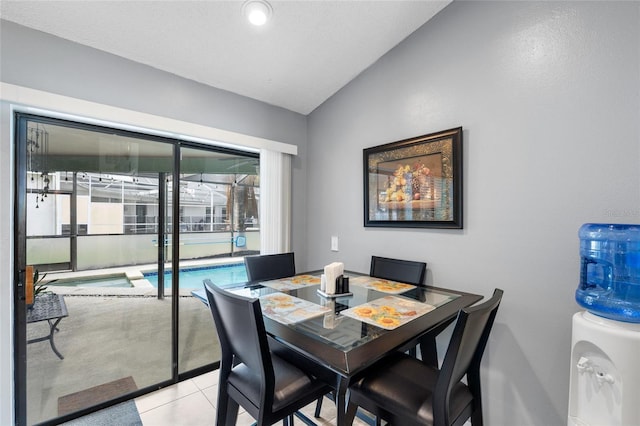 6621 Appaloosa Dr, Tampa, FL 33625 - dining space featuring vaulted ceiling and light tile patterned floors