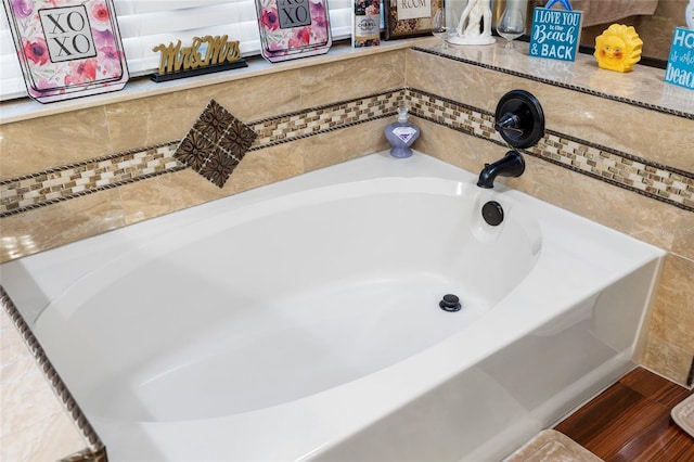 6621 Appaloosa Dr, Tampa, FL 33625 - bathroom with a bath and wood finished floors