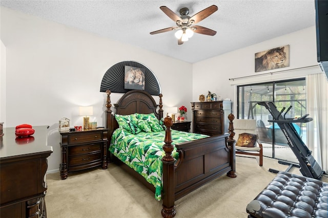 6621 Appaloosa Dr, Tampa, FL 33625 - bedroom featuring access to outside, light colored carpet, a textured ceiling, and ceiling fan