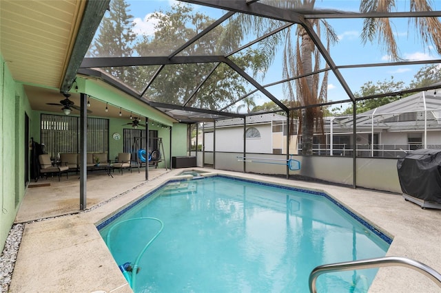 6621 Appaloosa Dr, Tampa, FL 33625 - view of swimming pool featuring a ceiling fan, a patio area, grilling area, a pool with connected hot tub, and glass enclosure