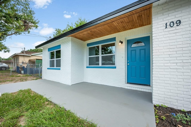 109 Magnolia Ave, Seffner, FL 33584 - doorway to property featuring brick siding
