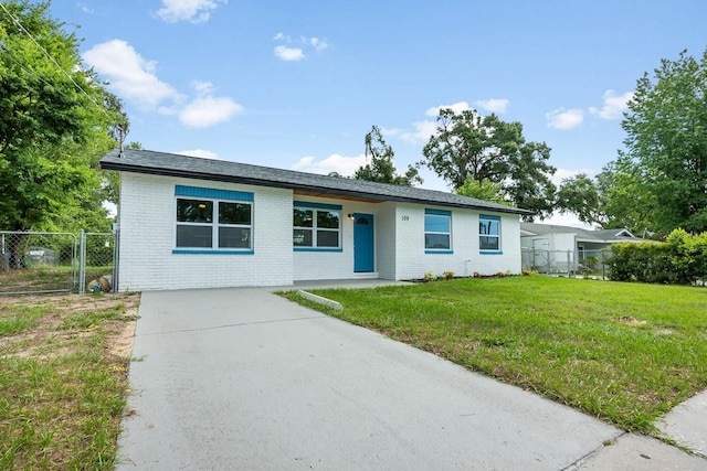 109 Magnolia Ave, Seffner, FL 33584 - ranch-style home featuring driveway, brick siding, and a gate