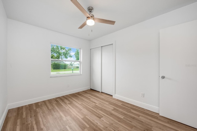 109 Magnolia Ave, Seffner, FL 33584 - unfurnished bedroom with light wood-style flooring, a closet, and a ceiling fan