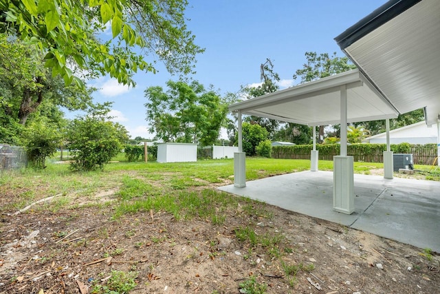109 Magnolia Ave, Seffner, FL 33584 - fenced backyard with a patio and a shed