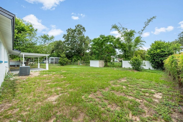 109 Magnolia Ave, Seffner, FL 33584 - fenced backyard featuring a storage shed and view of wooded area