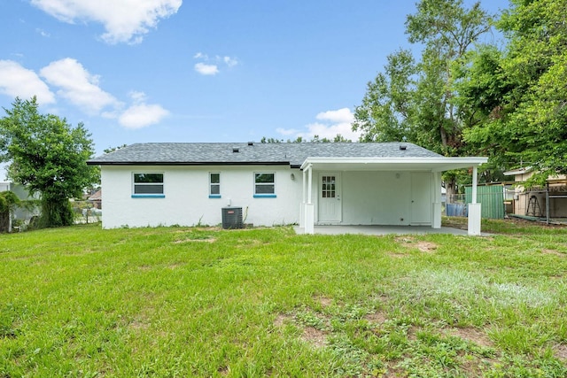 109 Magnolia Ave, Seffner, FL 33584 - back of house with stucco siding, a patio area, and an attached carport