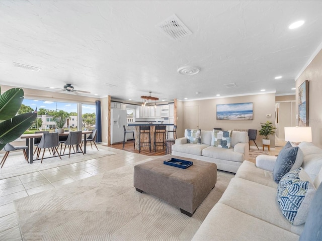 213 Fernwood Cir Unit 213, Seminole, FL 33777 - living area with recessed lighting, crown molding, and a ceiling fan