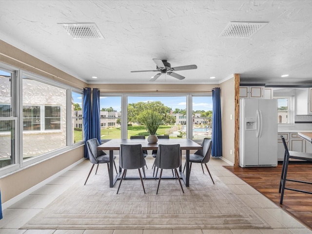 213 Fernwood Cir Unit 213, Seminole, FL 33777 - sunroom with tile patterned flooring, baseboards, recessed lighting, and crown molding