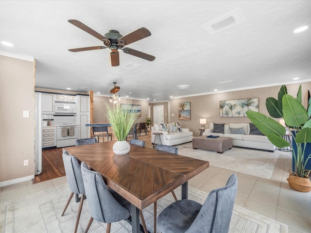 213 Fernwood Cir Unit 213, Seminole, FL 33777 - dining area with recessed lighting, light tile patterned floors, a ceiling fan, and baseboards