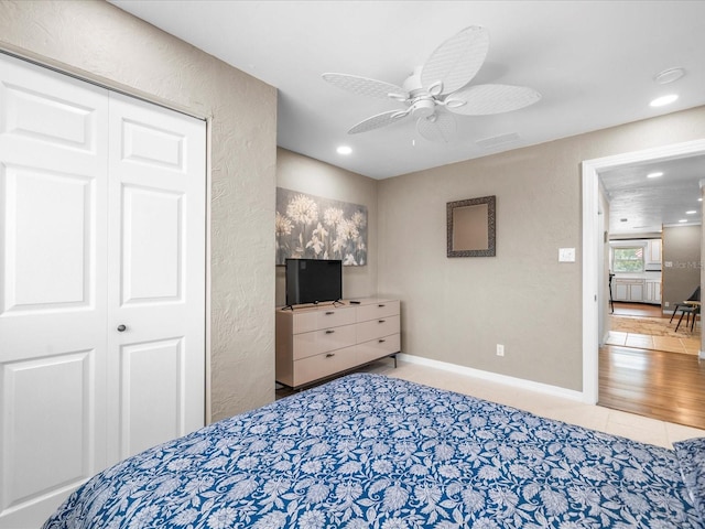 213 Fernwood Cir Unit 213, Seminole, FL 33777 - tiled bedroom featuring a textured wall, recessed lighting, a ceiling fan, and a closet