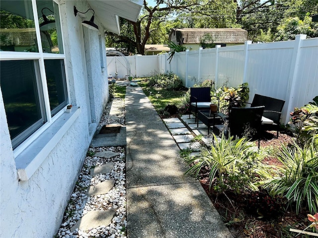 715 2nd Ave NE, Largo, FL 33770 - fenced backyard featuring a patio