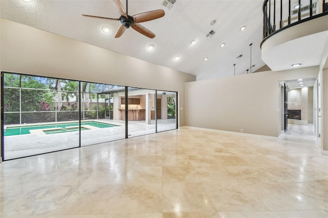 3308 Landing Pl, Palm Harbor, FL 34684 - spare room with ceiling fan and high vaulted ceiling