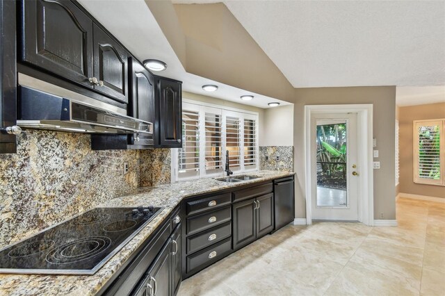 3308 Landing Pl, Palm Harbor, FL 34684 - kitchen with black electric stovetop, a sink, dishwasher, decorative backsplash, and light stone countertops