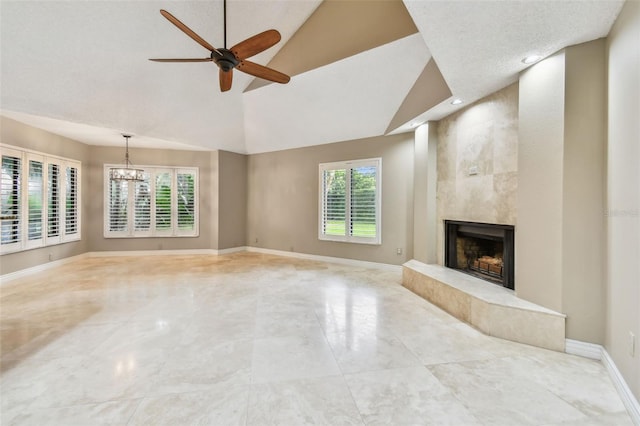 3308 Landing Pl, Palm Harbor, FL 34684 - unfurnished living room with a premium fireplace, plenty of natural light, ceiling fan, a chandelier, and recessed lighting