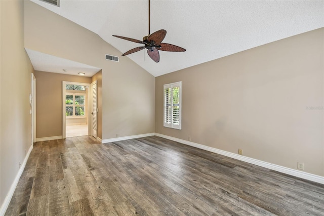 3308 Landing Pl, Palm Harbor, FL 34684 - spare room featuring a ceiling fan, healthy amount of natural light, wood finished floors, baseboards, and high vaulted ceiling
