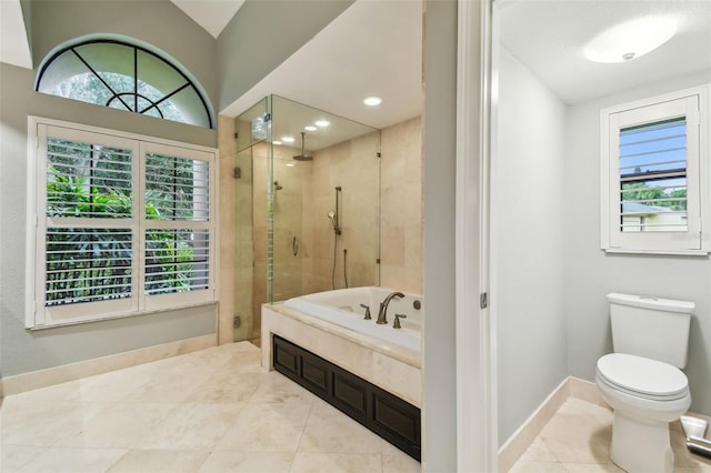 3308 Landing Pl, Palm Harbor, FL 34684 - full bathroom with a stall shower, healthy amount of natural light, a garden tub, and baseboards