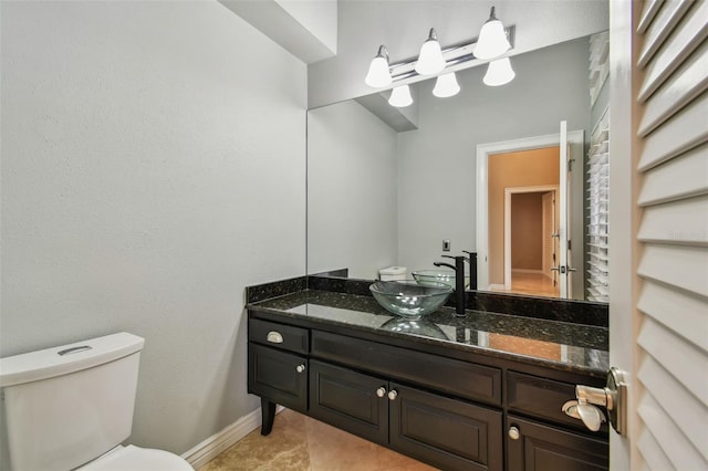 3308 Landing Pl, Palm Harbor, FL 34684 - bathroom with vanity, toilet, and baseboards