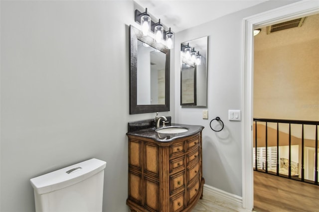 3308 Landing Pl, Palm Harbor, FL 34684 - bathroom featuring vanity, toilet, and baseboards