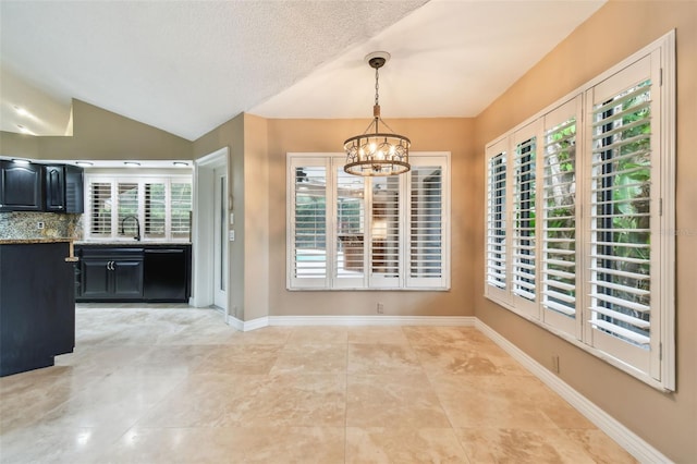 3308 Landing Pl, Palm Harbor, FL 34684 - unfurnished dining area featuring a chandelier, healthy amount of natural light, vaulted ceiling, light tile patterned floors, and baseboards