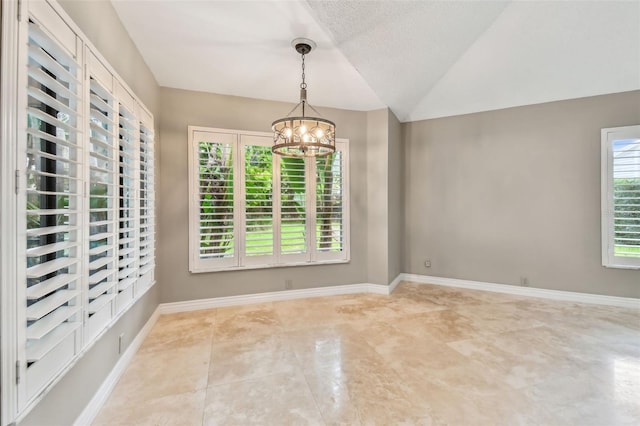 3308 Landing Pl, Palm Harbor, FL 34684 - unfurnished room featuring a chandelier, baseboards, tile patterned flooring, and vaulted ceiling