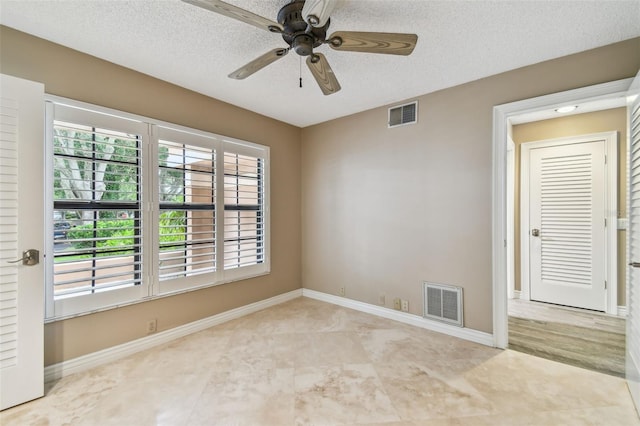 3308 Landing Pl, Palm Harbor, FL 34684 - unfurnished room with ceiling fan, a textured ceiling, and baseboards