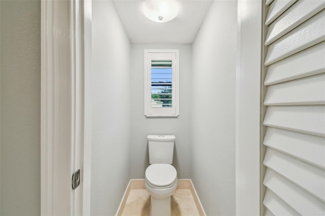 3308 Landing Pl, Palm Harbor, FL 34684 - bathroom with baseboards and toilet