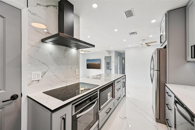 7930 Jeffery Ave, North Port, FL 34287 - kitchen featuring wall chimney range hood, stainless steel appliances, recessed lighting, light stone counters, and ceiling fan