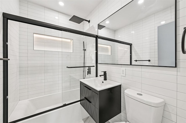7930 Jeffery Ave, North Port, FL 34287 - full bath with enclosed tub / shower combo, toilet, vanity, tile walls, and recessed lighting