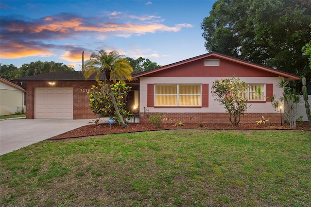 7276 21st St N, Saint Petersburg, FL 33702 - ranch-style home featuring concrete driveway, a garage, and a yard