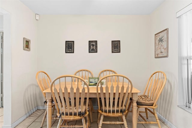 7276 21st St N, Saint Petersburg, FL 33702 - dining area with baseboards and light tile patterned flooring