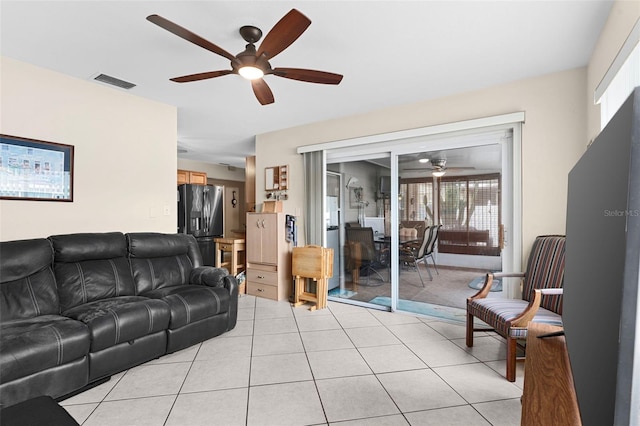 7276 21st St N, Saint Petersburg, FL 33702 - living room with ceiling fan and light tile patterned floors