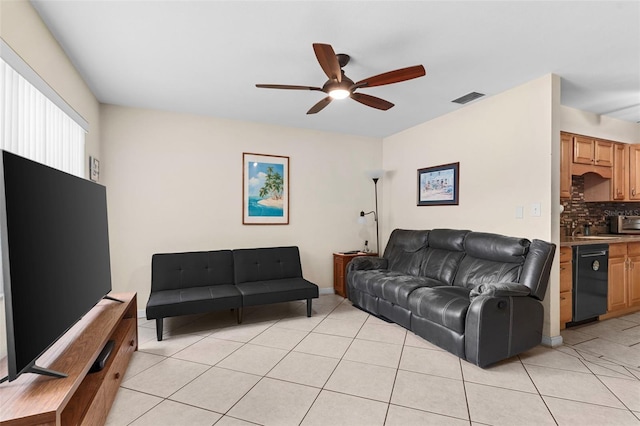 7276 21st St N, Saint Petersburg, FL 33702 - living area with ceiling fan and light tile patterned floors