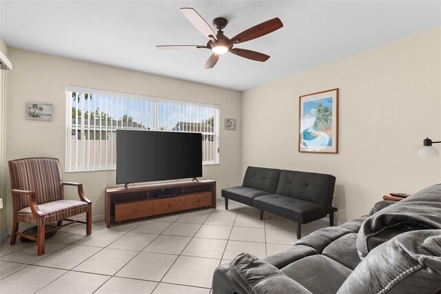 7276 21st St N, Saint Petersburg, FL 33702 - living area featuring a ceiling fan, light tile patterned floors, and baseboards