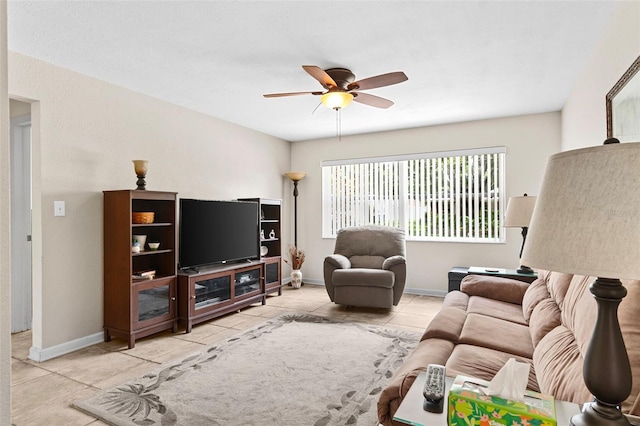 7276 21st St N, Saint Petersburg, FL 33702 - living room with ceiling fan, tile patterned flooring, and baseboards