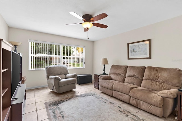 7276 21st St N, Saint Petersburg, FL 33702 - living room featuring ceiling fan, light tile patterned floors, and baseboards