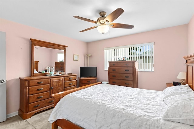 7276 21st St N, Saint Petersburg, FL 33702 - bedroom with ceiling fan and light tile patterned flooring