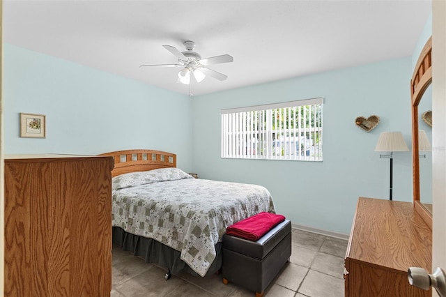 7276 21st St N, Saint Petersburg, FL 33702 - bedroom with ceiling fan, baseboards, and light tile patterned flooring