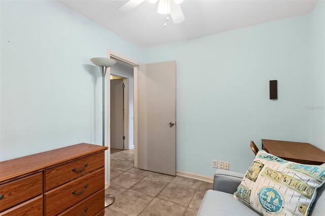 7276 21st St N, Saint Petersburg, FL 33702 - sitting room featuring ceiling fan, baseboards, and light tile patterned floors