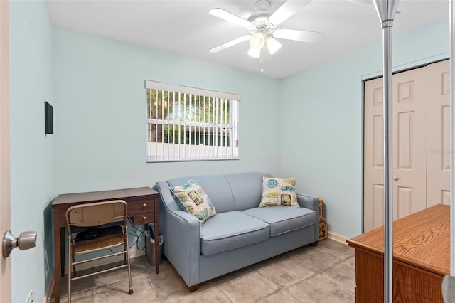 7276 21st St N, Saint Petersburg, FL 33702 - living room with ceiling fan, light tile patterned floors, and baseboards