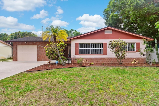 7276 21st St N, Saint Petersburg, FL 33702 - ranch-style house featuring concrete driveway, a garage, a front lawn, and brick siding