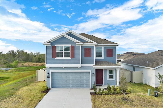 271 Inman Blvd, Winter Haven, FL 33881 - view of front of house featuring a garage, concrete driveway, a gate, a shingled roof, and stucco siding