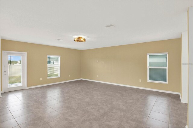 271 Inman Blvd, Winter Haven, FL 33881 - spare room with tile patterned floors and baseboards
