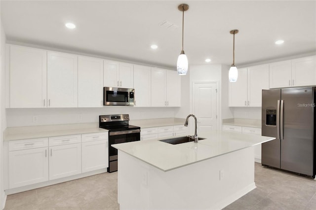 271 Inman Blvd, Winter Haven, FL 33881 - kitchen with stainless steel appliances, a sink, white cabinetry, decorative light fixtures, and recessed lighting