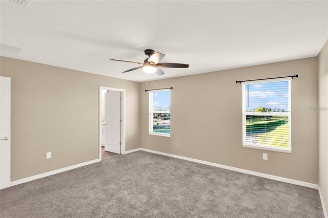 271 Inman Blvd, Winter Haven, FL 33881 - carpeted empty room featuring a ceiling fan, healthy amount of natural light, and baseboards