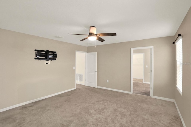 271 Inman Blvd, Winter Haven, FL 33881 - unfurnished bedroom featuring multiple windows, carpet floors, baseboards, and ceiling fan