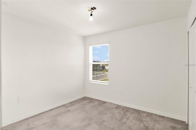 271 Inman Blvd, Winter Haven, FL 33881 - empty room with light carpet and baseboards